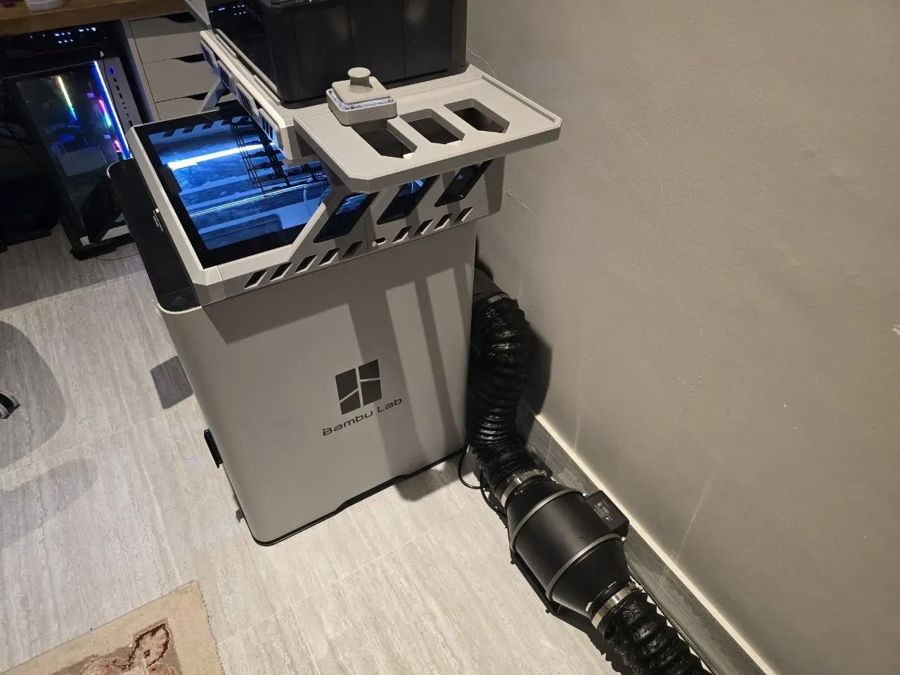 Bambu Lab H2S enclosed 3D printer with an inline-fan exhaust
